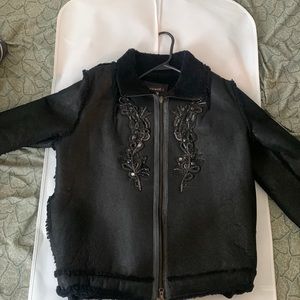 Black, medium nice jacket for ladies almost never worn. Looks and feels like new